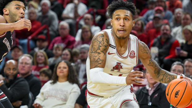 Razorbacks' Jeremiah Davenport drives the baseline against South Carolina